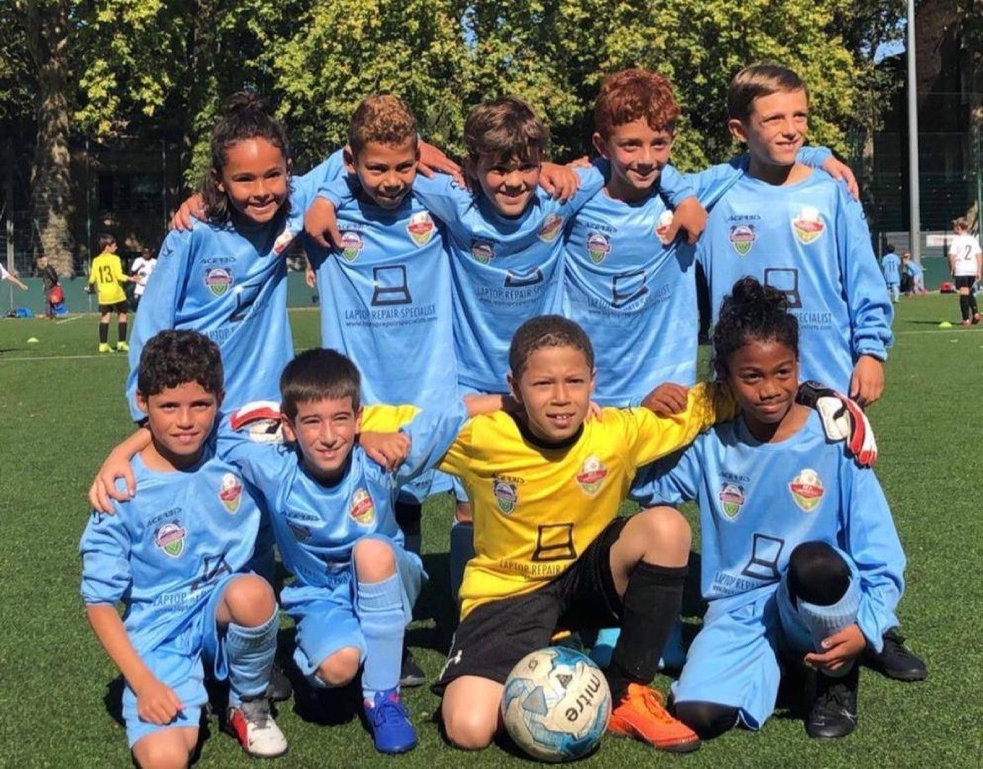 PFA United players in sky-blue kit lined up on an outdoor pitch