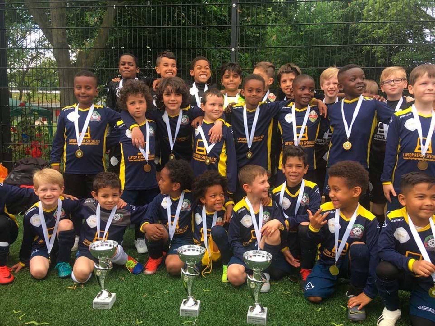 PFA United players with medals and trophies